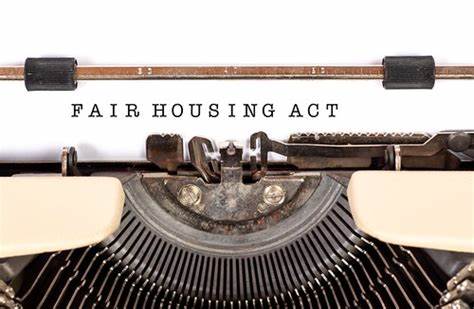 Typewriter showing Fair Housing Act on the paper